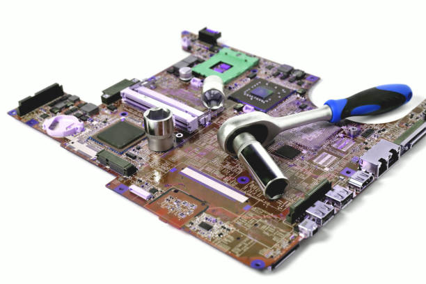 istock The socket wrench lies on the old chip for the laptop, isolate, large scale, tinting 1305082926