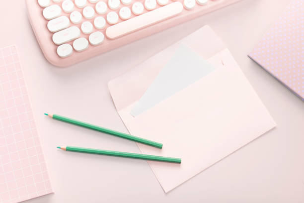istock flat lay pink color envelope and stationery 1305083836