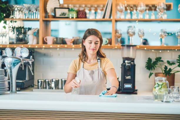 istock Keeping her cafe's hygiene standards up to scratch 1305085144