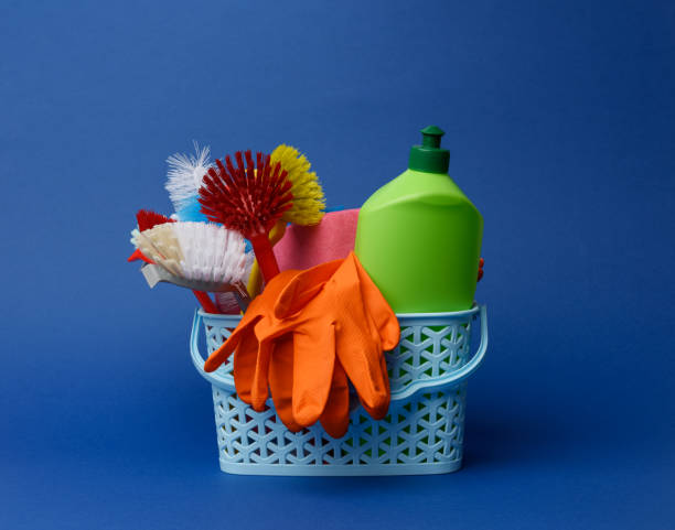istock blue plastic basket with brushes, sponges and rubber gloves for cleaning 1305086263