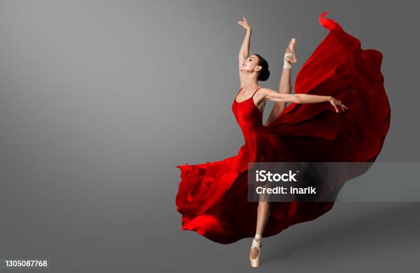 Ballerina Dance Ballet Dancer In Red Dress Jumping Spit Woman In Ballerina Shoes Dancing In Evening Silk Gown Flying On Wind Stock Photo - Download Image Now