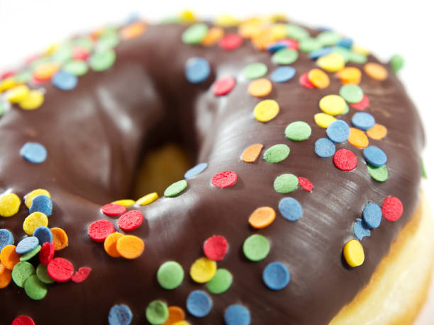 istock chocolate glazed donut or doughnut with colorful sprinkles 1305088134