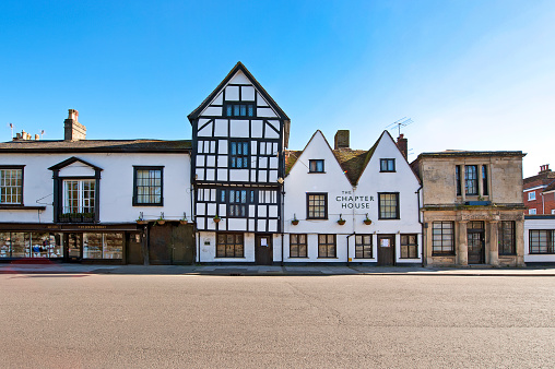 Architectural terrace of styles, Salisbury, Wiltshire, England, UK. Clear blue skies and crisp winter days outdoors typify an English February in Wiltshire where the colours of the clearly defined medieval and ancient architecture stand out as historical landmarks in the scenic countryside and beautiful town