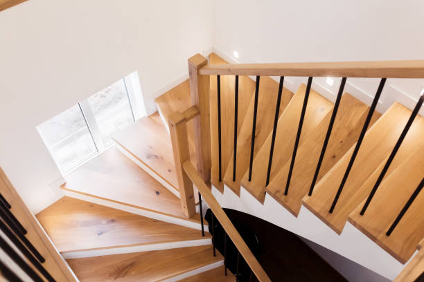 istock Wood staircase inside contemporary white modern house. 1305090901