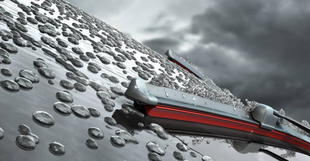 car wipers with red silicone coating sweep water from the car windshield 3d render against a cloudy sky stock photo