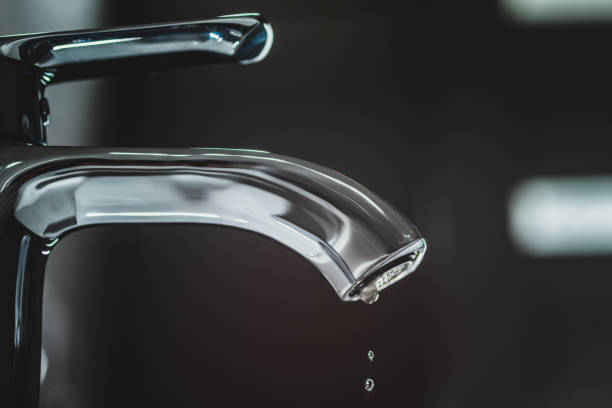 istock A drop of pure water dripping from the tap. 1305095266