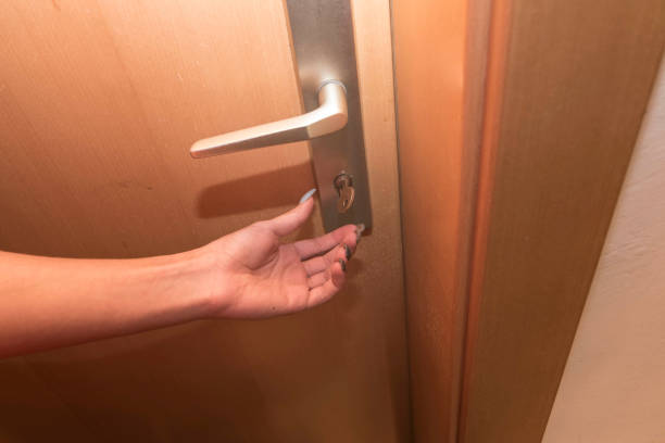 istock locking doors and porperty with a key, security against burglary 1305096981