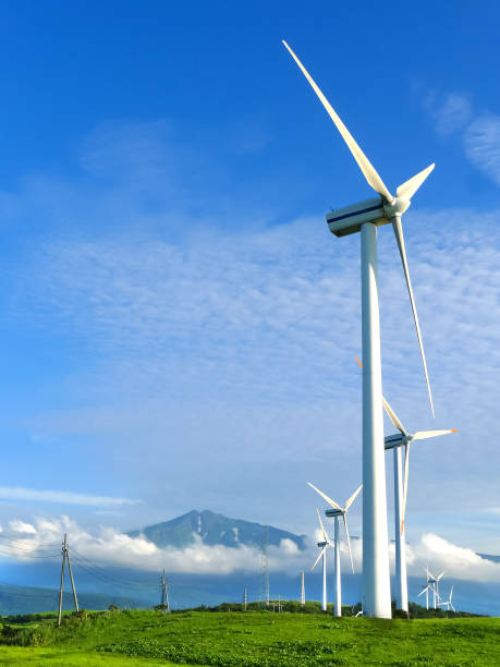 Wind Power Station Wind power station on a hill with a mountain view. climate justice photos stock pictures, royalty-free photos & images