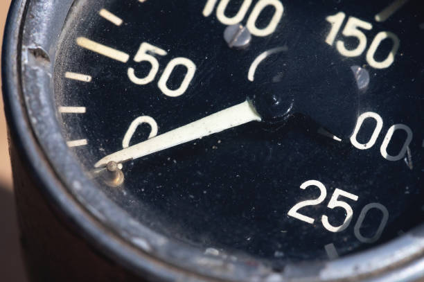 istock Old rusty round industrial pressure gauge with numbers on a black dial 1305098882