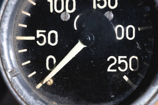 istock Old rusty round industrial pressure gauge with numbers on a black dial 1305098888