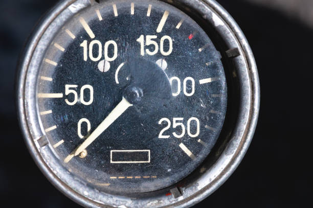 istock Old rusty round industrial pressure gauge with numbers on a black dial 1305098891