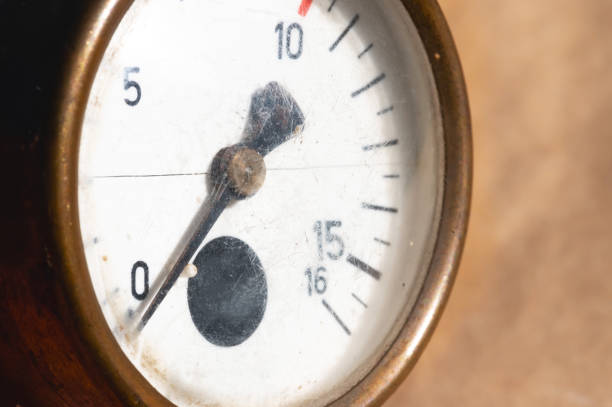 istock Old rusty round industrial pressure gauge with numbers on a white dial. 1305098903