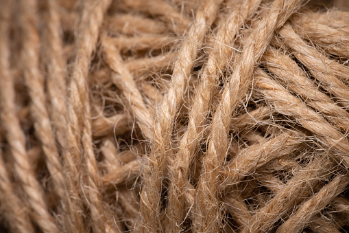 Natural jute twine, macro photography. Jute thread texture. A coil of jute rope. Close-up.