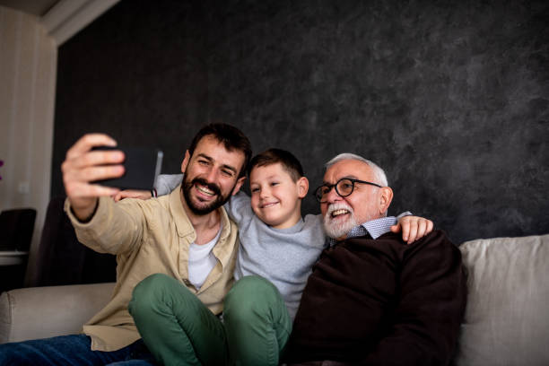 istock Grandfather having great time during his family visit. 1305103336
