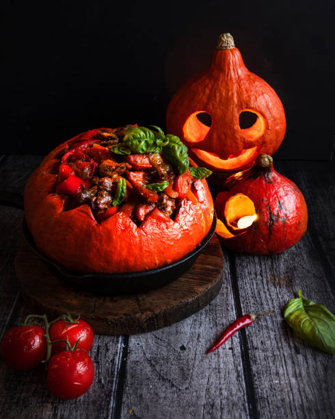 istock Stuffed pumpkin with meat and vegetables. Halloween 1305108090