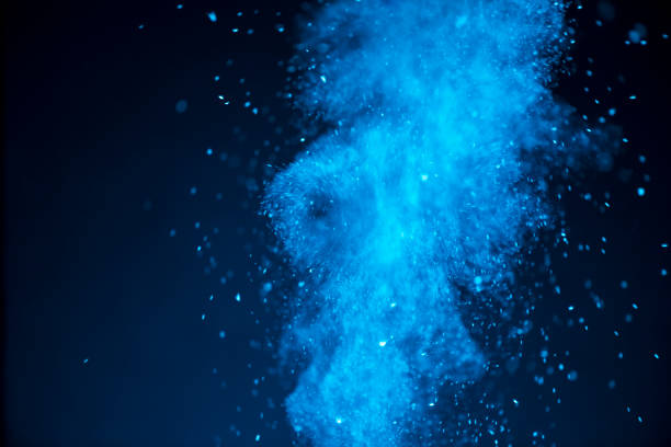 istock Swirl powder explosion abstract background in blue 1305108148