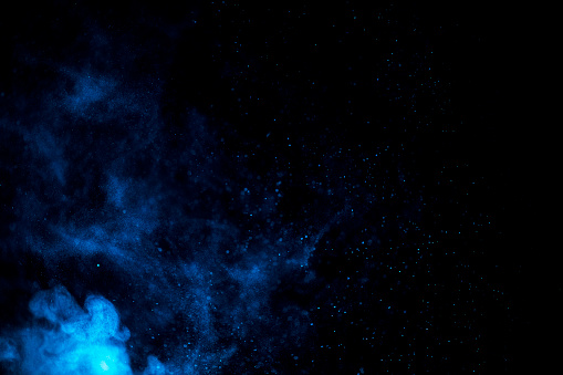 Left corner powder cloud in blue abstract background