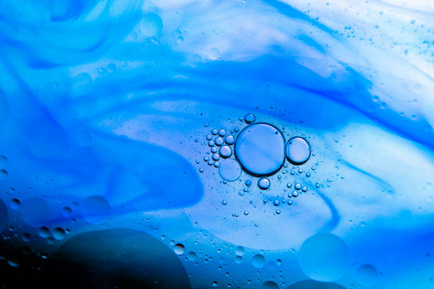 istock Group of bubbles on blue ink liquid background 1305108656