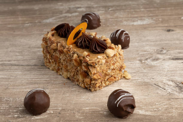 istock appetizing piece of cake next to chocolate balls, pastry in a studio 1305109971