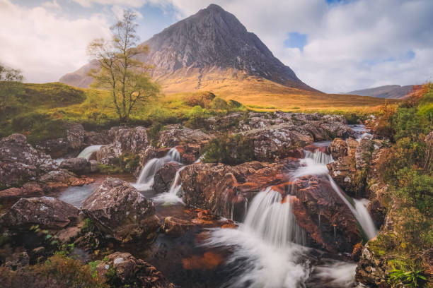 Buachaille Etive Mor. Glencoe, Scottish Highlands Dramatic mountain landscape of the iconic Buachaille Etiv Mor and River Coupall waterfall at Glencoe in the Scottish Highlands, Scotland. buachaille etive mor photos stock pictures, royalty-free photos & images