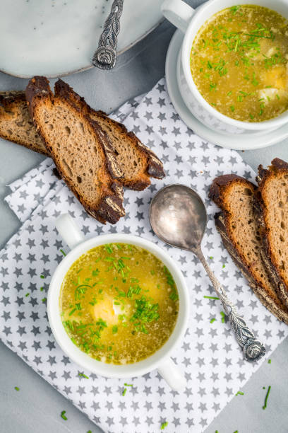 istock Homemade egg soup with fresh sourdough bread or crostini 1305113360