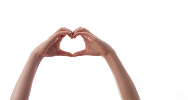 istock woman hands showing heart 1305113459