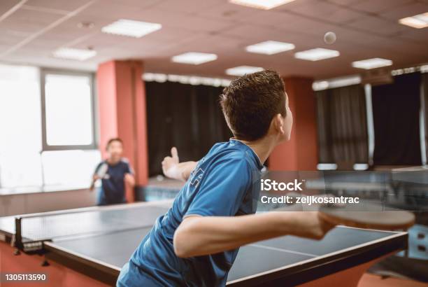 Different Generations Play Table Tennis Stock Photo - Download Image Now - Table Tennis, Games Room, Child
