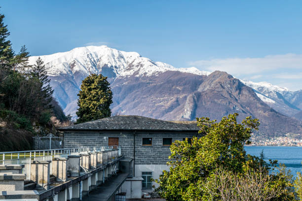 the Abbey of Piona with the Alps in background