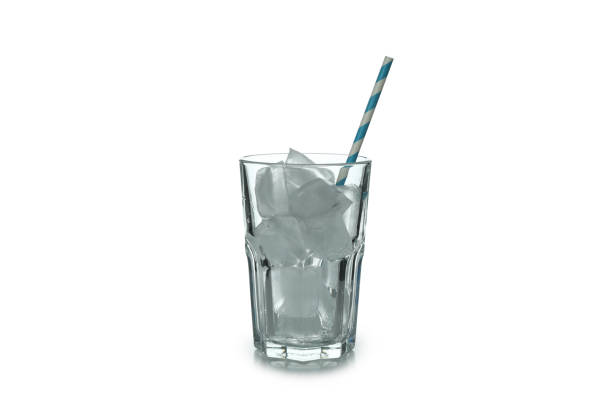istock Glass with ice cubes and straw isolated on white background 1305117171