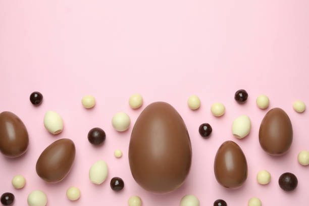 istock Easter chocolate eggs and candies on pink background 1305118441