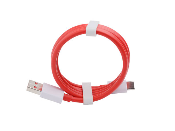 istock USB cable for charging your smartphone and transferring data, twisted. Isolated on a white background 1305118753