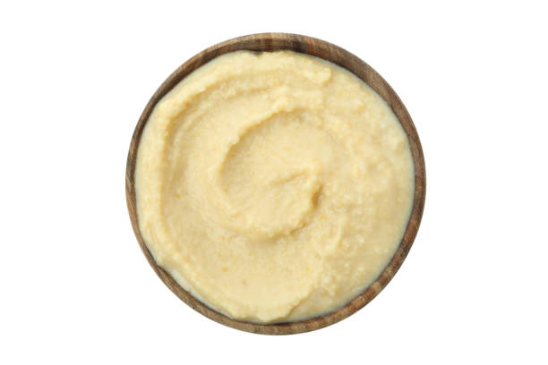 istock Bowl of fresh hummus isolated on white background 1305119198