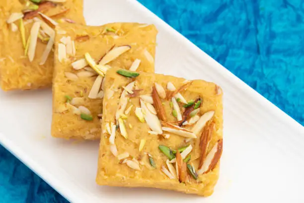 Photo of Indian Mithai Lachedar Patisa With Various Names Soan Papdi San Papdi Sohan Papdi Sukhdi Or Sonpapdi Son Roll Is Made Of Gram Wheat Flour Besan Kaju Pista Badam Dry Fruits Jaggery Fried In Desi Ghee