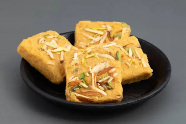 Photo of Indian Mithai Lachedar Patisa With Various Names Soan Papdi San Papdi Sohan Papdi Sukhdi Or Sonpapdi Son Roll Is Made Of Gram Wheat Flour Besan Kaju Pista Badam Dry Fruits Jaggery Fried In Desi Ghee