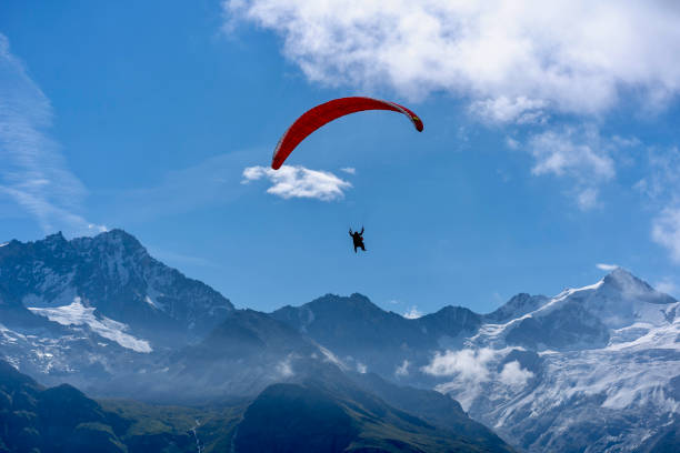 istock Tandem paragliding man with child at Zinal Sorebois. 1305121263