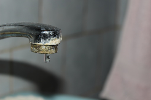 an old rotten fountain leaks