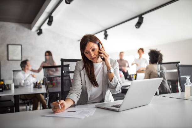 istock Brunette woman, looking busy. 1305131156