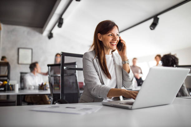 istock Portrait of business woman, using modern technology. 1305131166