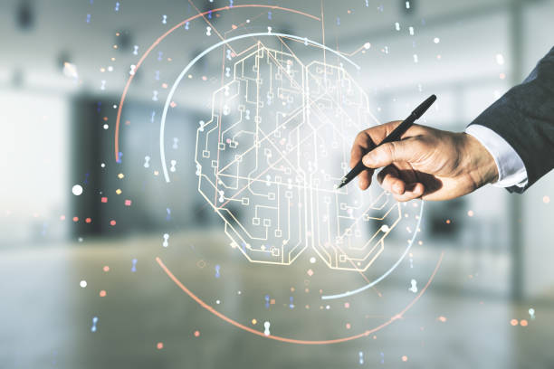 istock Man hand with pen working with virtual creative artificial Intelligence hologram with human brain sketch on blurred office background. Multiexposure 1305131208