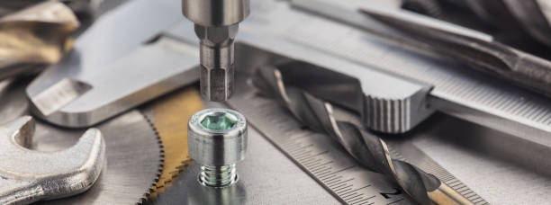 istock Hex drill bit screw hex bolt in metal steel plate with ruler and caliper. Spanner, bolt, screw and nuts. 1305132436