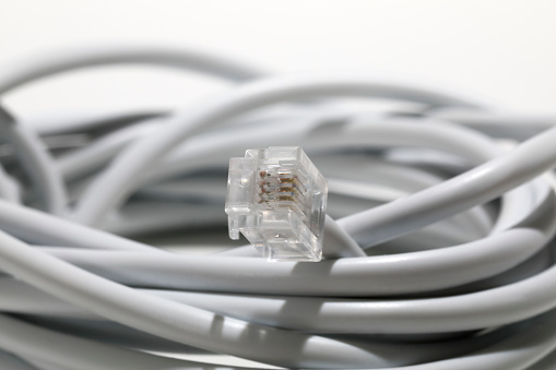 Telephone network cord with 4-pin plug. The symbol of this connector is rj11.