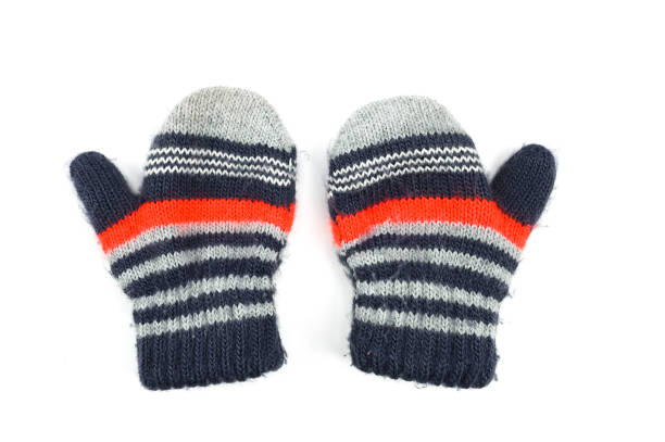 istock Baby striped mittens, on an isolated white background 1305135406