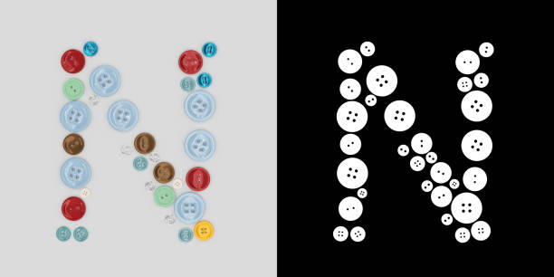 istock Letter N of sewing button alphabet. Alphabet from buttons . Letter from buttons. Font from buttons. On a white background. 3D 1305139572