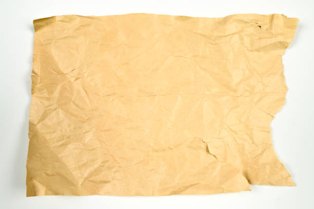 istock Yellow crumpled, torn paper on isolated white background 1305141393