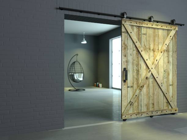 Barn Sliding Wooden Door in Loft Room 3d illustration. Modern interior in loft style barn sliding wooden door in loft room. Studio interior of old house garret stock pictures, royalty-free photos & images