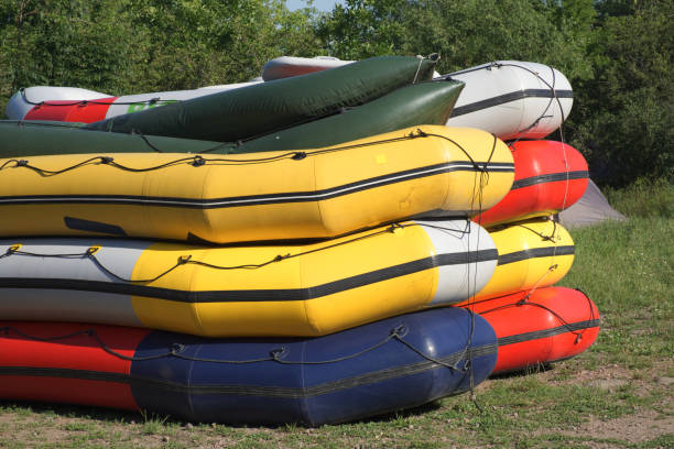 istock Multi-colored rafting boats stacked on top of each other. 1305143185