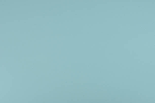 istock Pale Blue paper background. Sky blue colour paper texture. 1305144670