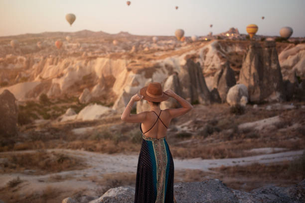 istock traveling woman cappadocia. rear view 1305145310