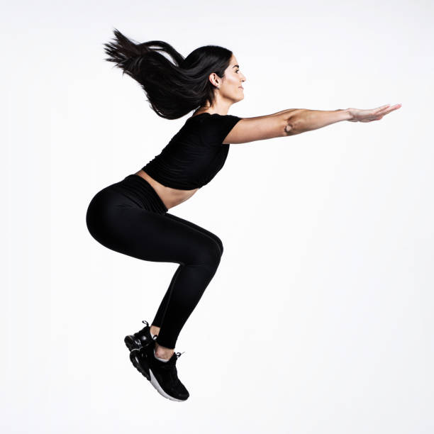istock Athletic female doing squats and jumps 1305146793