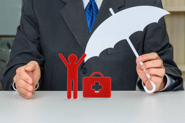 istock Broker or insurer protects a man with first aid bag 1305147652